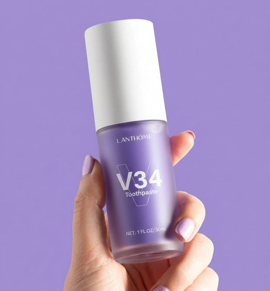 Bottle of Lanthorne V34 toothpaste held by a hand against a purple background